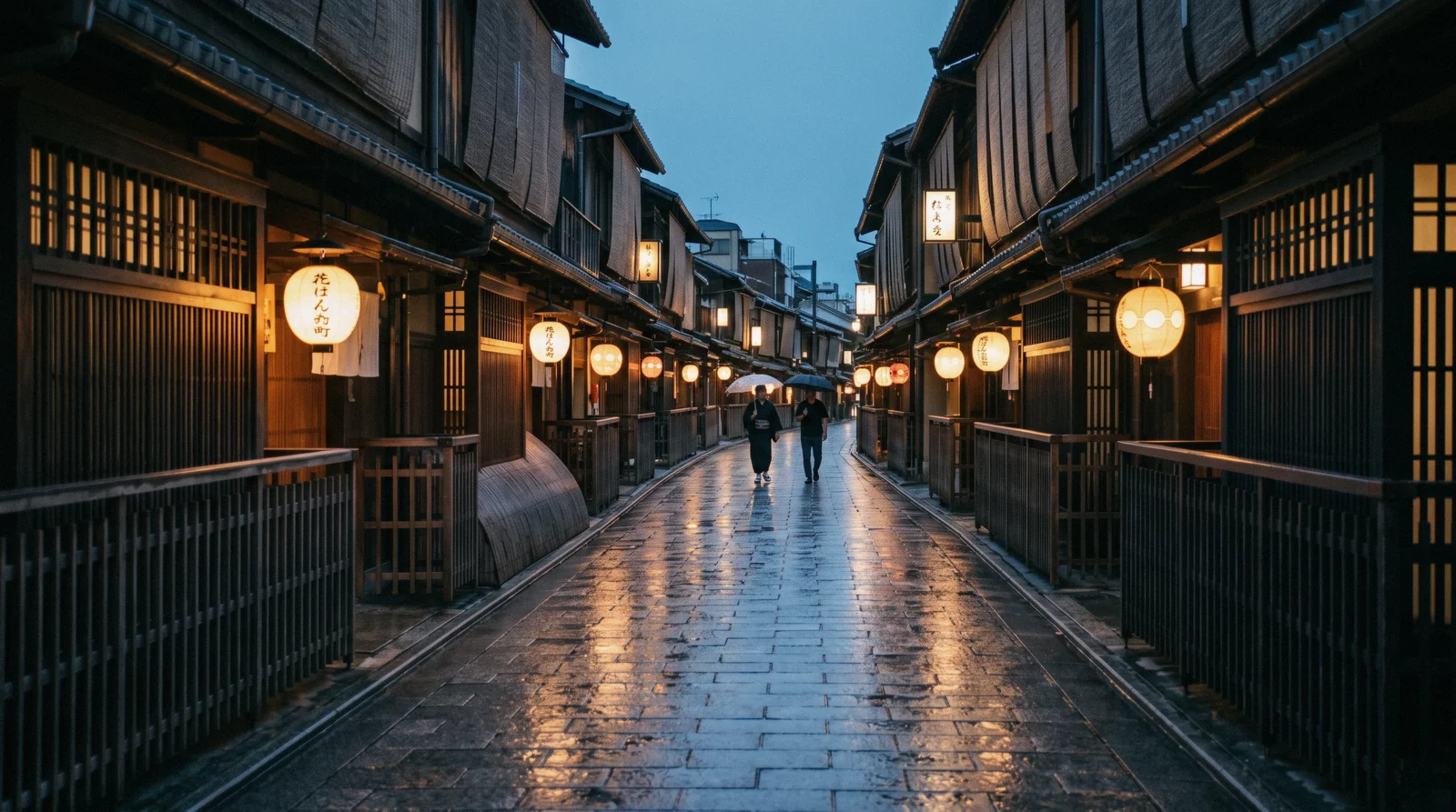 Wooden ochaya fronts and hanging lanterns along Hanamikoji in Gion in the blue hour, Kyoto Japan