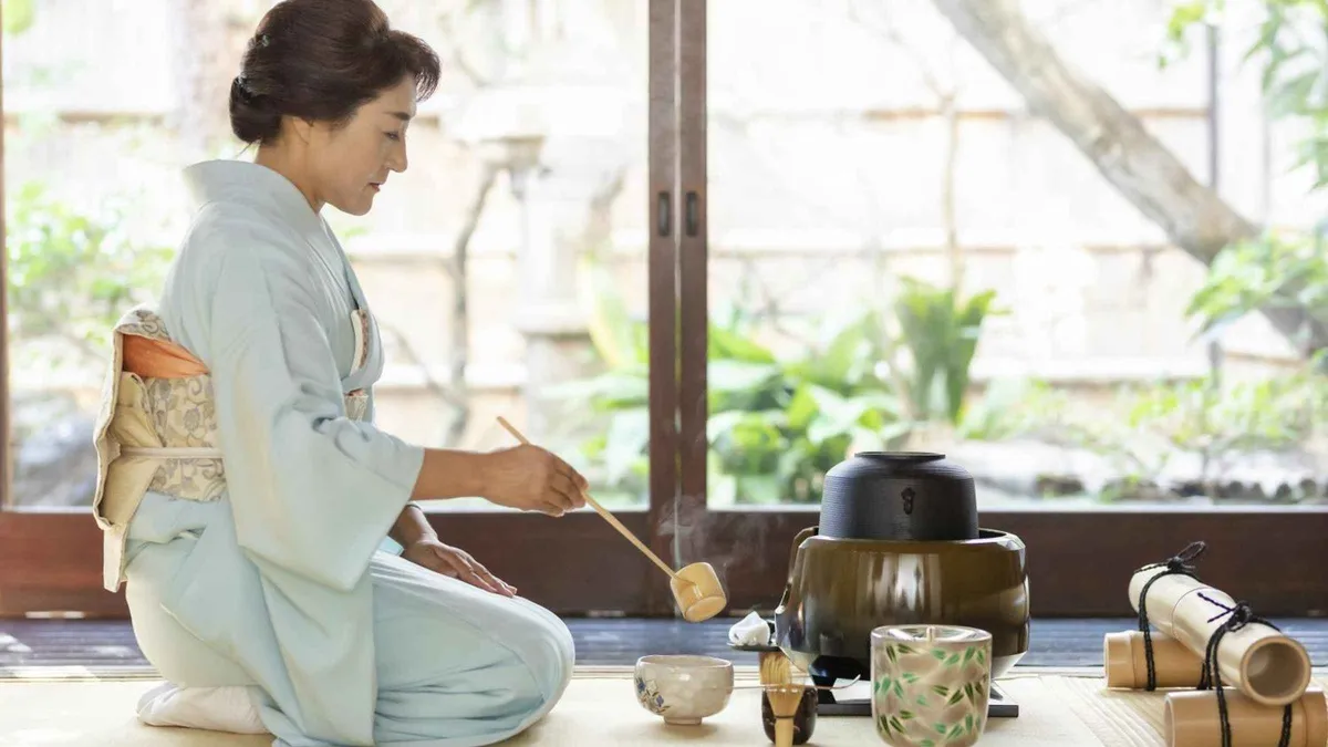 Matcha bowl and seasonal wagashi on tatami in a Kyoto machiya tea room, Kyoto Japan