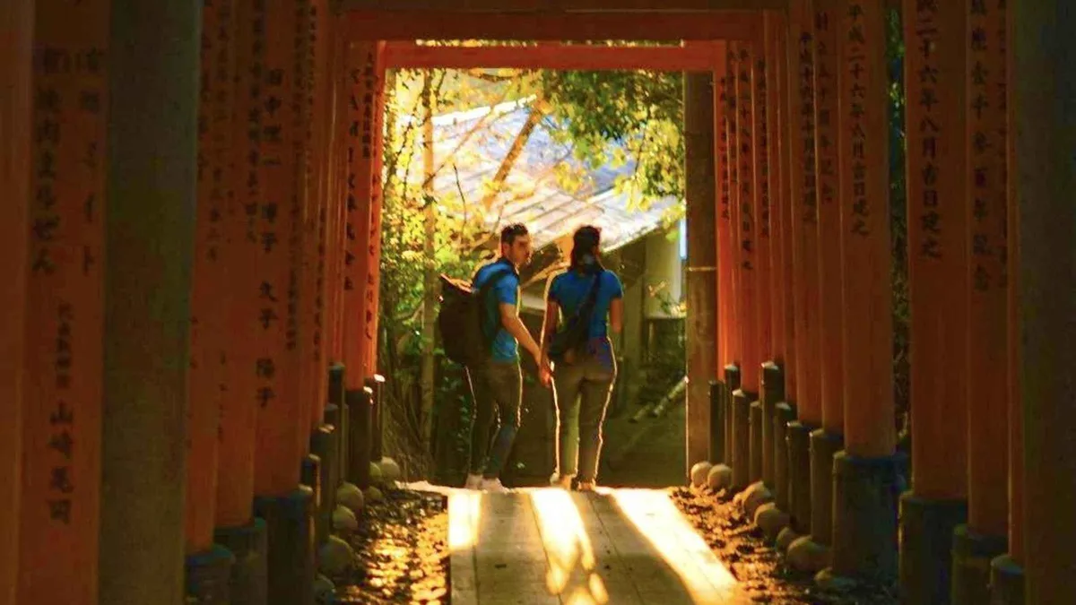 Illuminated torii tunnel at Fushimi Inari on a night walking tour, Kyoto Japan