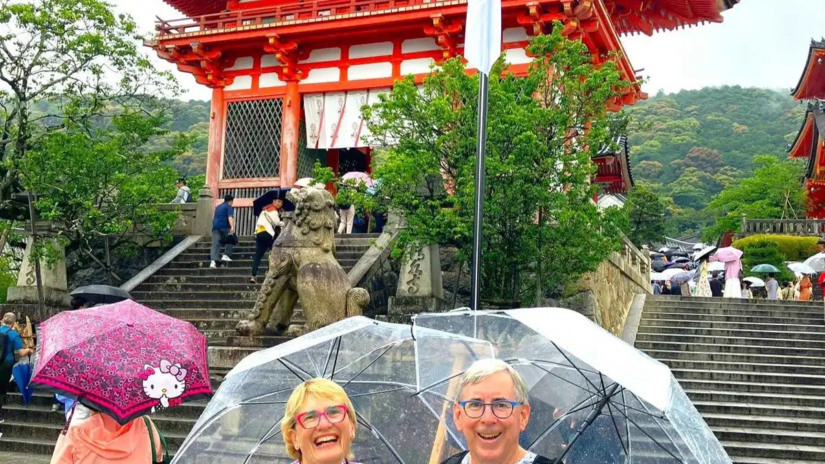 The wooden stage of Kiyomizu-dera above the hillside on a UNESCO guided tour, Kyoto Japan