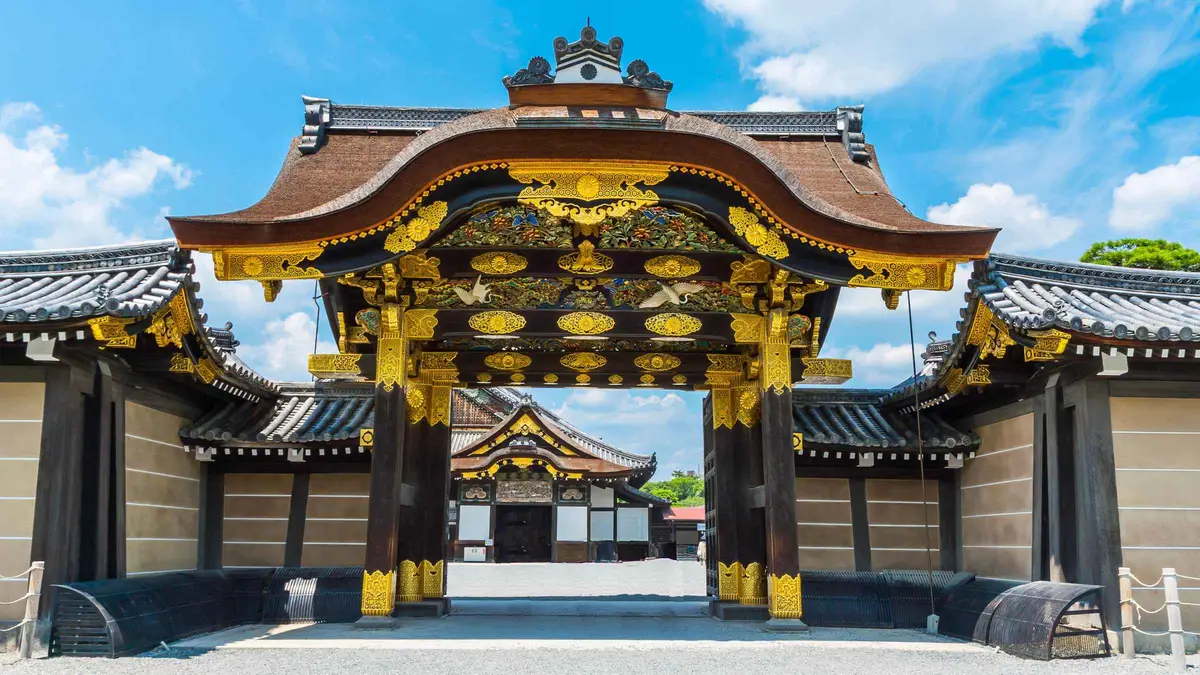 The Golden Pavilion reflected in its pond on a Kyoto and Osaka day tour, Kyoto Japan