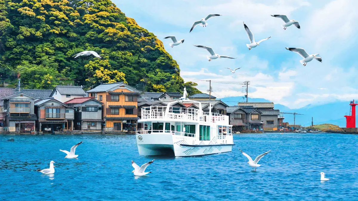 Sightseeing boat passing the funaya houses of Ine Bay on a day trip from Kyoto, Kyoto Japan