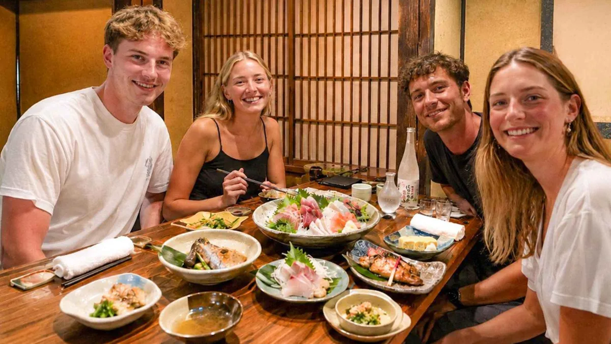 Small plates and drinks at an izakaya counter on a Gion and Pontocho food tour, Kyoto Japan