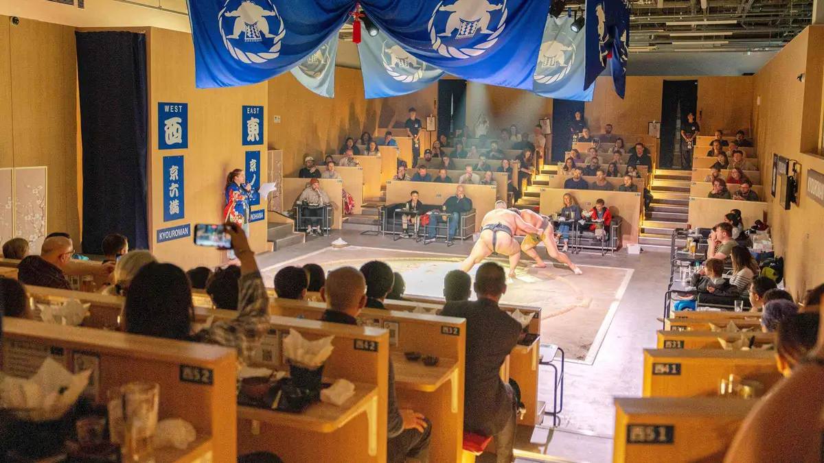 Sumo wrestlers in the ring at a Kyoto dinner show with chanko-nabe, Kyoto Japan