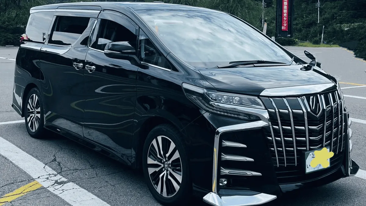 Private transfer vehicle at the arrivals kerb of Kansai International Airport bound for Kyoto, Kyoto Japan