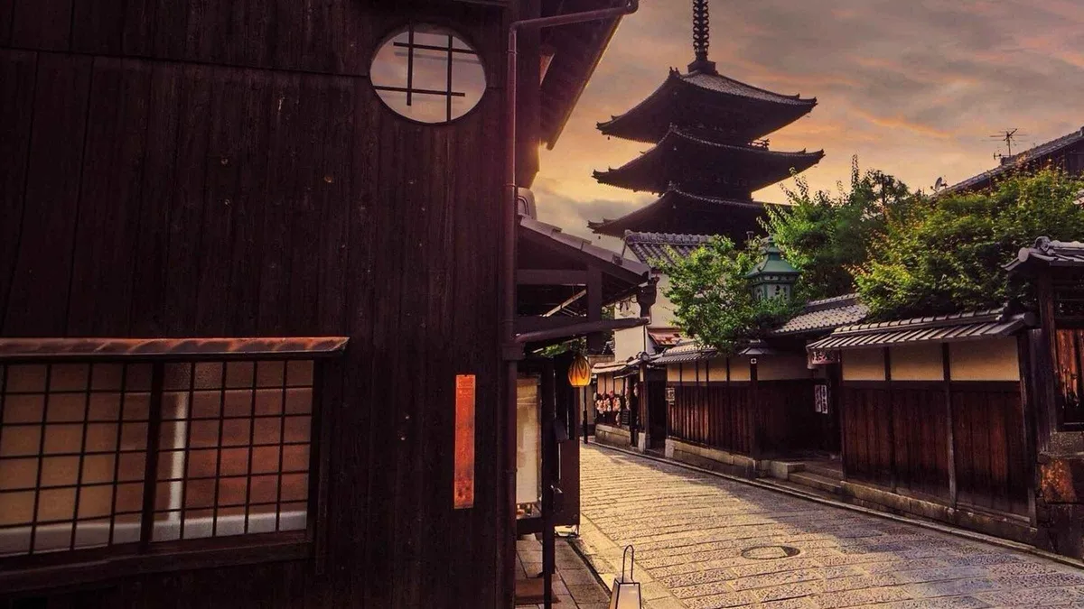 Lantern-lit teahouse fronts on Hanamikoji in Gion on a guided evening walking tour, Kyoto Japan